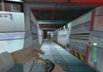 Cross this sloping corridor and zip through the door.